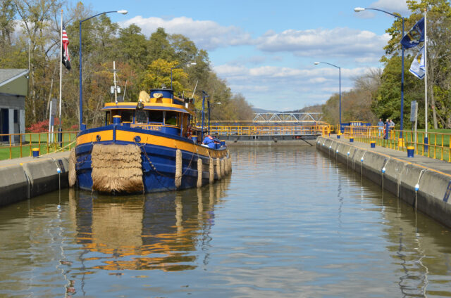 A tugboat in a canal way.