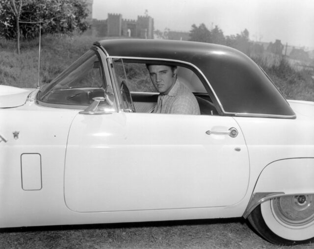 Elvis Presley in a car.