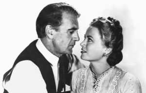Gary Cooper and Grace Kelly looking at one another.