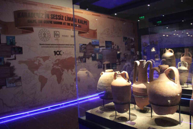 Amphorae on display in a museum.
