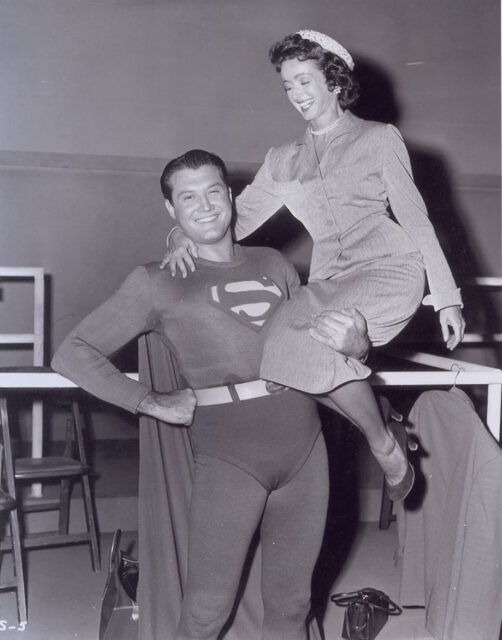 Noel Neill on the shoulder of George Reeves as superman.