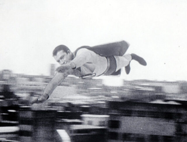 George Reeves flying through the air.