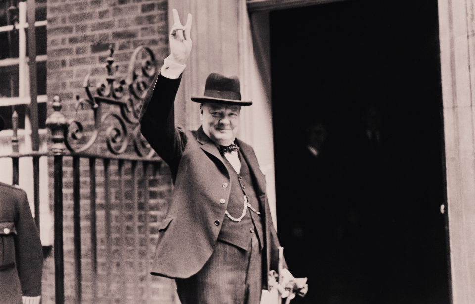 Prime Minister Winston Churchill outside 10 Downing Street, gesturing his famous 'V for Victory' hand signal, London, June 1943. (Photo Credit: H F Davis/Topical Press Agency/Hulton Archive/Getty Images)