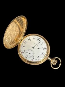 An open gold pocket watch.