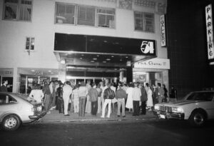 crowd of people waiting in line outside new york club Studio 54