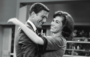 Dick Van Dyke and Mary Tyler Moore in an embrace.