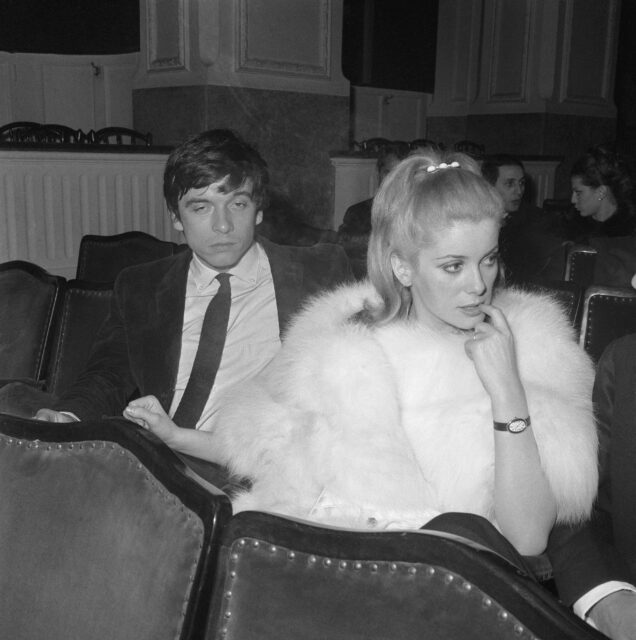 Catherine Deneuve and David Bailey sitting together.