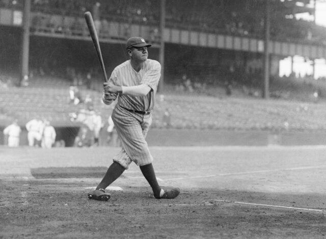 babe ruth at home plate holding bat