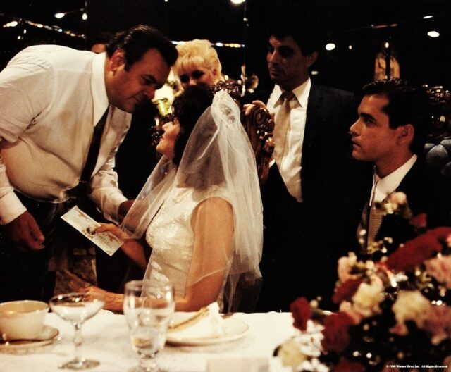 A scene of Henry Hill and Karen Hill being talked to by Paul Cicero in Goodfellas.